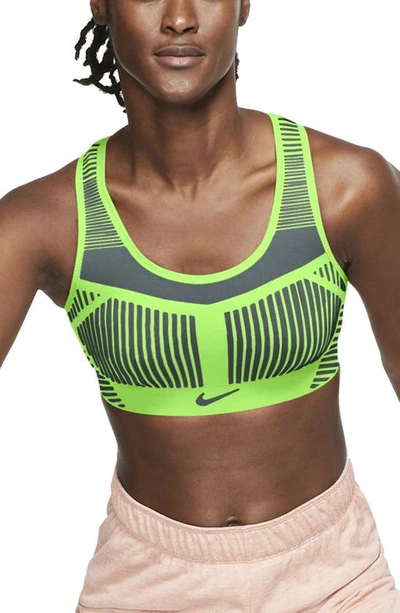 Shop Nike Fe/nom Flyknit Racerback Sports Bra In Lime Glow/ Hasta