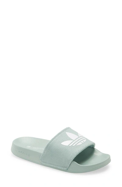 Shop Adidas Originals Adilette Comfort Slide Sandal In Hazy Green/ White/ White