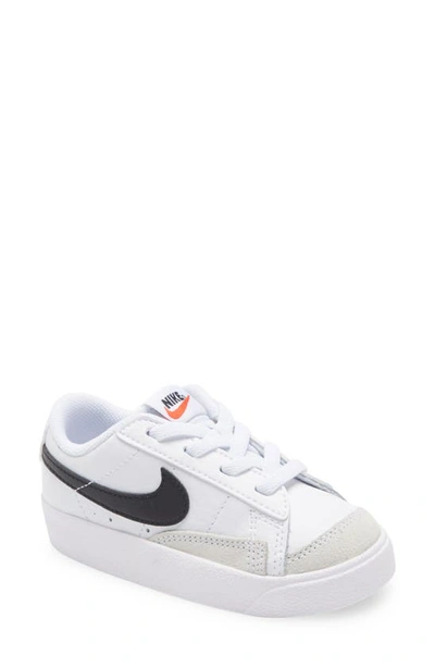Shop Nike Kids' Blazer Low '77 Sneaker In White/ Black/ Orange