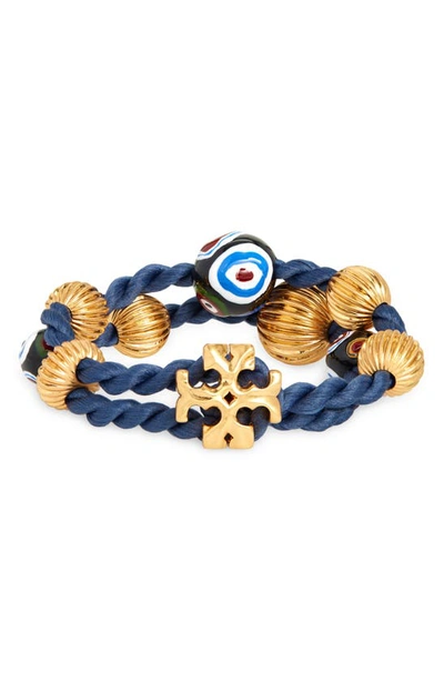 Shop Tory Burch Roxanne Logo Wrap Bracelet In Rolled Brass/tory Nav/multi