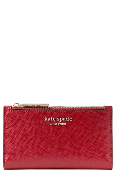 Shop Kate Spade Small Spencer Slim Leather Bifold Wallet In Red Currant