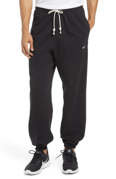 Shop Nike Dri-fit Standard Issue Joggers In Black/ Pale Ivory
