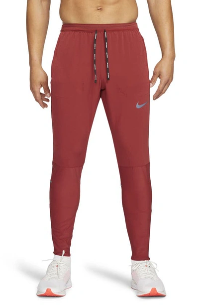 Shop Nike Swift Running Pants In Dark Cayenne/ Dark Cayenne