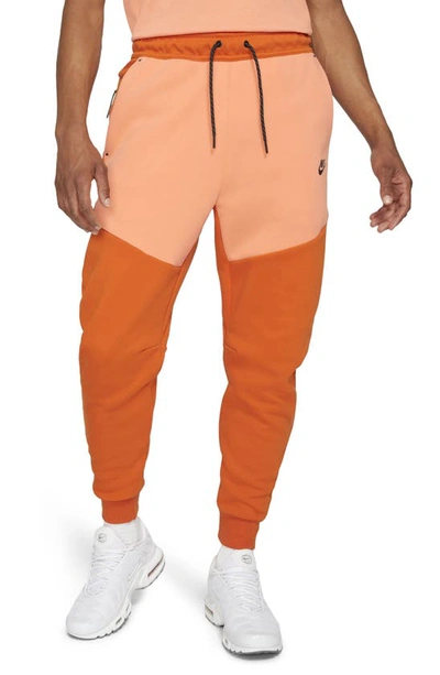 Shop Nike Tech Fleece Jogger Sweatpants In Campfire/ Orange/ Black