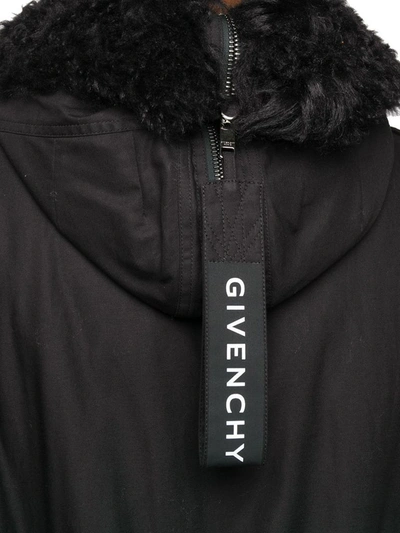 Givenchy Furry Hood Belted Parka Coat In Black