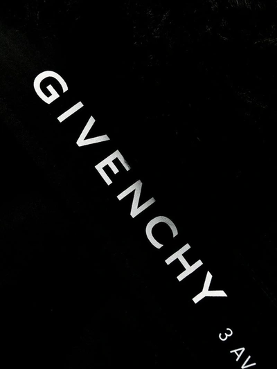 Givenchy Furry Hood Belted Parka Coat In Black