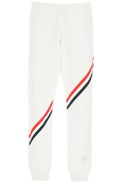 Shop Thom Browne Joggers With Diagonal Stripes In White