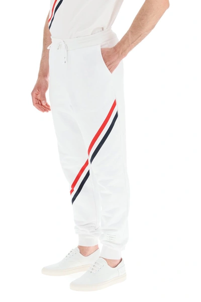 Shop Thom Browne Joggers With Diagonal Stripes In White