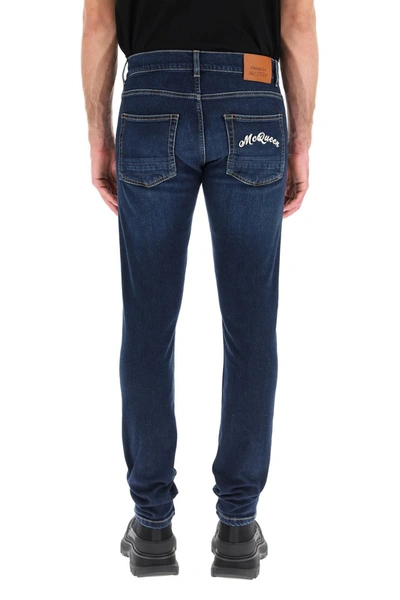 Shop Alexander Mcqueen Jeans With Logo Embroidery In Blu Washed