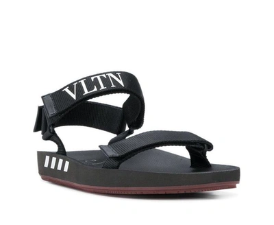 Shop Valentino Vltn Logo Sandals In Black