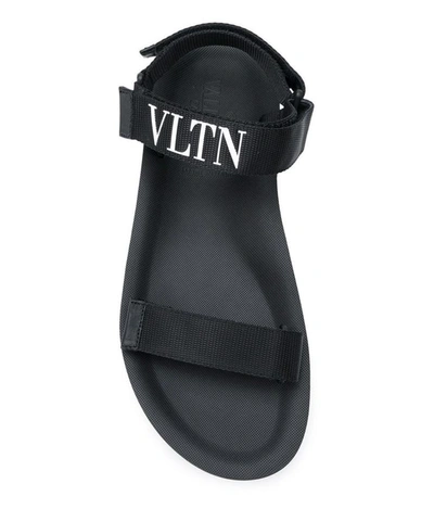 Shop Valentino Vltn Logo Sandals In Black