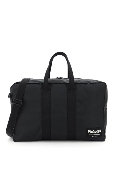 Shop Alexander Mcqueen Nylon Duffle Bag With Graffiti Logo Patch In Black Black Off W