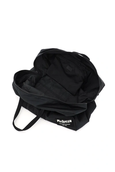Shop Alexander Mcqueen Nylon Duffle Bag With Graffiti Logo Patch In Black Black Off W