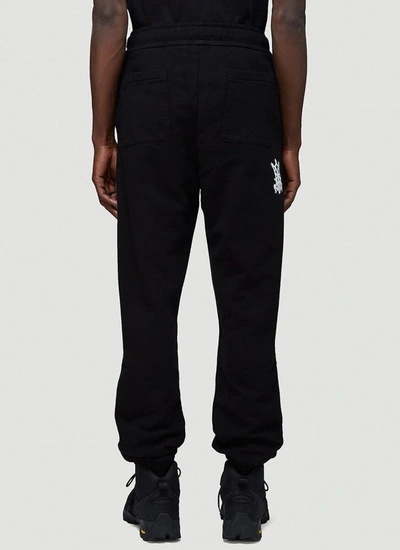 Shop Moncler Genius Mocler X Craig Green Logo Print Track Pants In Black