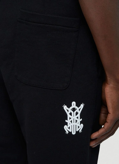 Shop Moncler Genius Mocler X Craig Green Logo Print Track Pants In Black