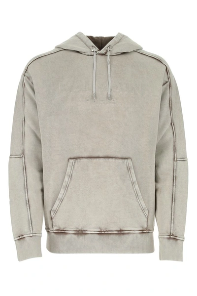 Shop Balmain Logo Embossed Hoodie In Grey