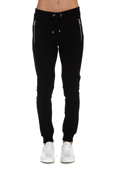 Shop Balmain Logo Embossed Sweatpants In Black
