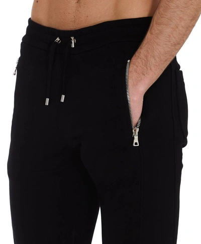 Shop Balmain Logo Embossed Sweatpants In Black
