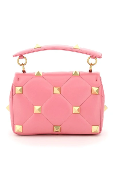 Shop Valentino Garavani Roman Stud Medium Handbag In Pink