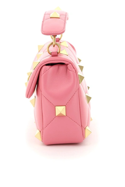 Shop Valentino Garavani Roman Stud Medium Handbag In Pink
