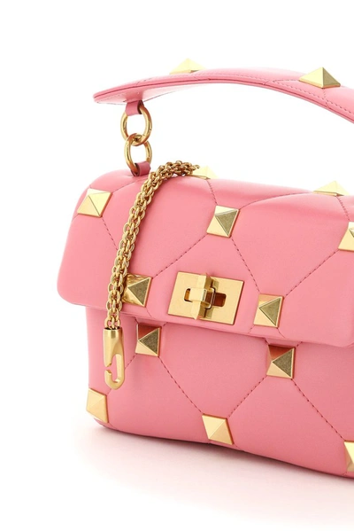 Shop Valentino Garavani Roman Stud Medium Handbag In Pink