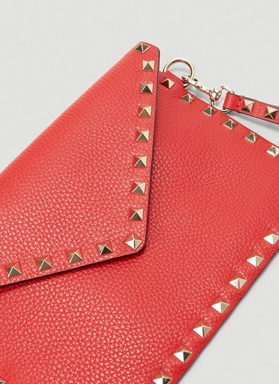 Shop Valentino Garavani Rockstud Medium Envelope Pouch Bag In Red