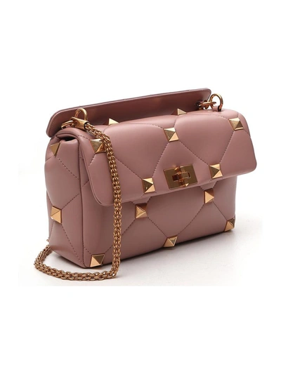 Shop Valentino Garavani Roman Stud Shoulder Bag In Pink