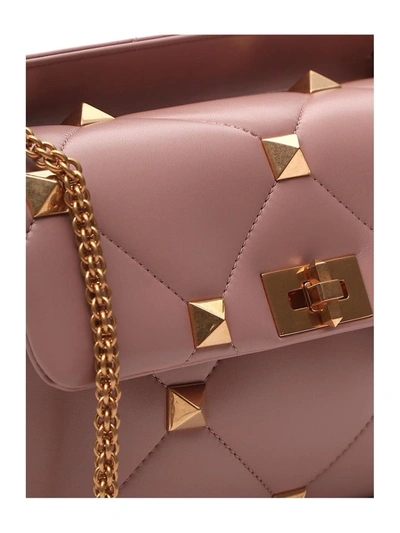 Shop Valentino Garavani Roman Stud Shoulder Bag In Pink