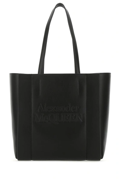 Shop Alexander Mcqueen Logo Embossed Tote Bag In Black