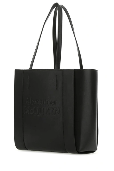 Shop Alexander Mcqueen Logo Embossed Tote Bag In Black