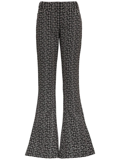 Shop Balmain Monogram Flared Bootcut Pants In Multi