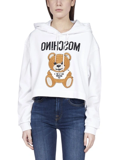 Shop Moschino Teddy Cropped Hooded Sweatshirt In White