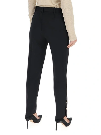 Shop Versace Button Embellished Pants In Black