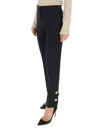 Shop Versace Button Embellished Pants In Black