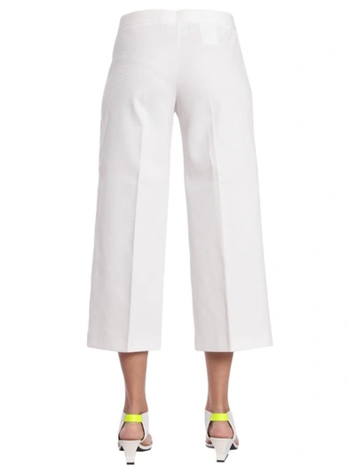 Shop Boutique Moschino Wide Leg Cropped Trousers In White