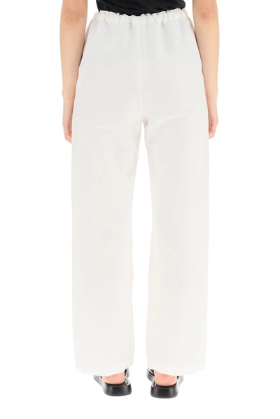 Shop Totême Wide Leg Trousers In White