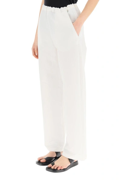 Shop Totême Wide Leg Trousers In White