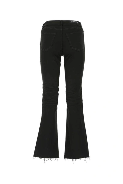 Shop Balenciaga Frayed Hem Flared Jeans In Black