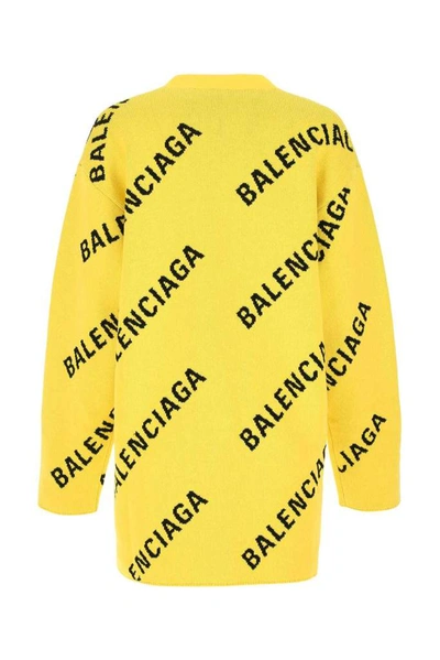 Shop Balenciaga Allover Logo Knitted Cardigan In Yellow