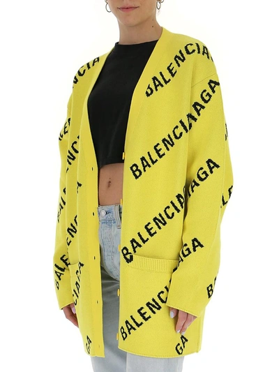 Shop Balenciaga Allover Logo Knitted Cardigan In Yellow
