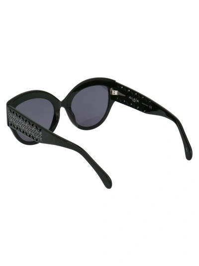 Shop Alaïa Oversized Cat Eye Frame Sunglasses In Black