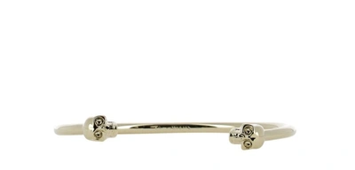 Shop Alexander Mcqueen Thin Twin Skull Bracelet In Gold