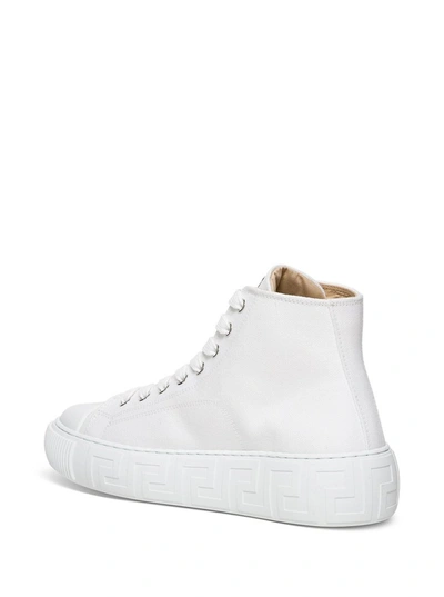 Shop Versace Greca High Top Sneakers In White