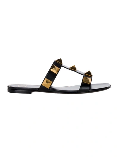 Shop Valentino Garavani Roman Stud Flat Sandals In Black