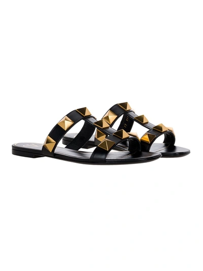 Shop Valentino Garavani Roman Stud Flat Sandals In Black