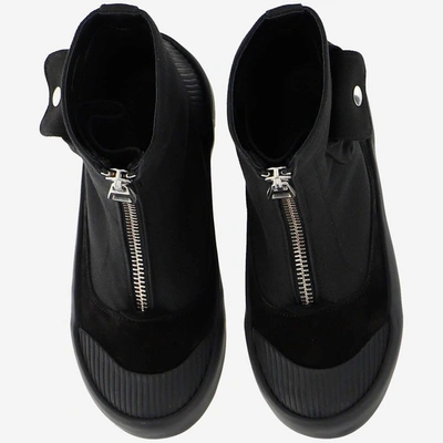 Shop Jw Anderson Side Pockets Zipped Boots In Black