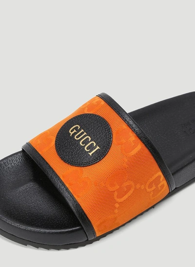 Shop Gucci Off The Grid Slides In Orange