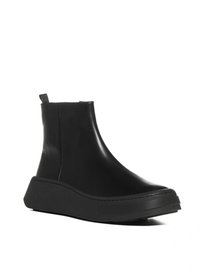 Shop Prada Wedged Ankle Boots In Black