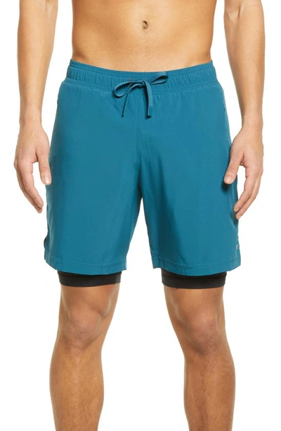 Shop Alo Yoga Unity 2-in-1 Shorts In Mineral Blue/ Black