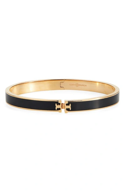 Shop Tory Burch Kira Logo Enamel Hinge Bracelet In Tory Gold / Black